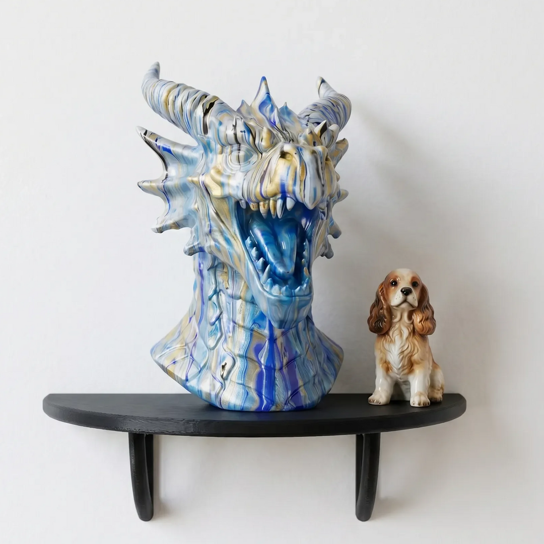Black curved wall shelf displaying a blue dragon head sculpture and a small dog ornament