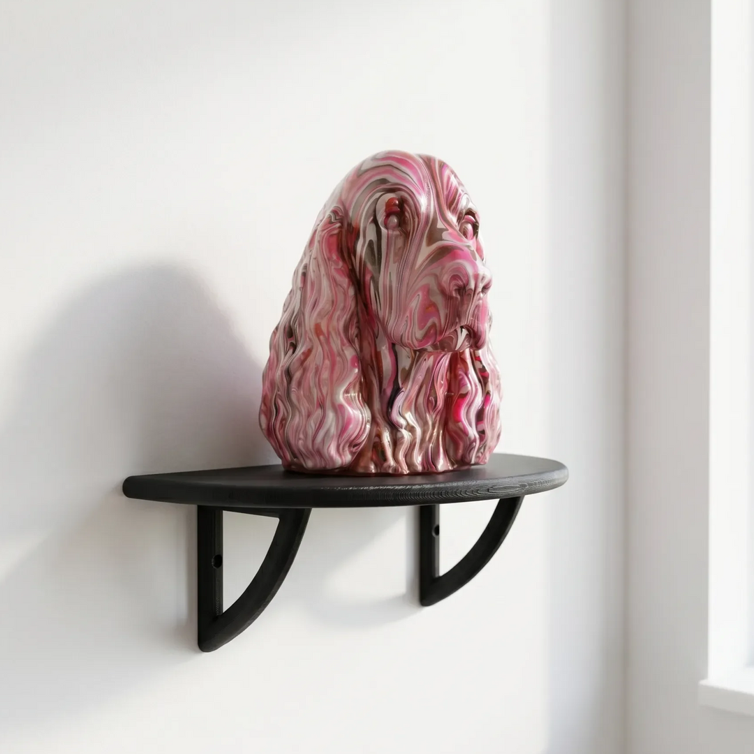 Black curved wall display shelf holding a pink and white spaniel head sculpture