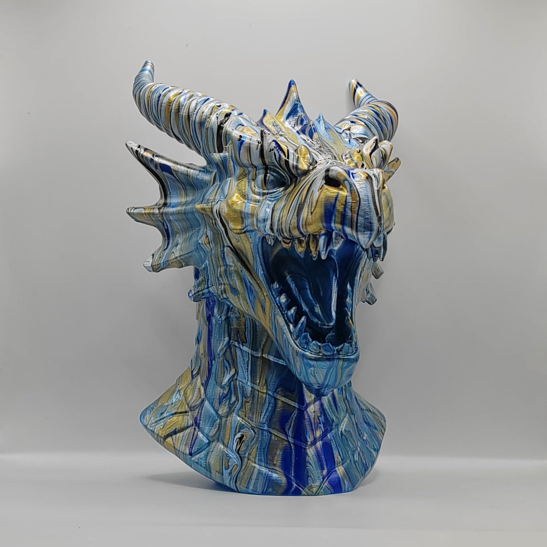 Hand-painted blue and gold dragon statue with an open mouth