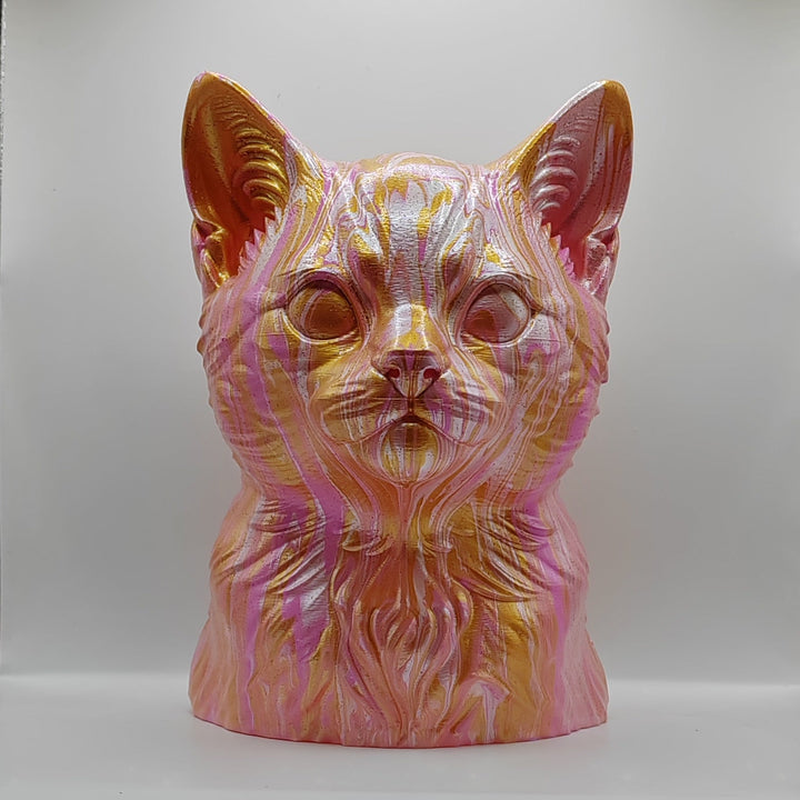 Front view of a hand-painted kitten head ornament in pink, gold and white