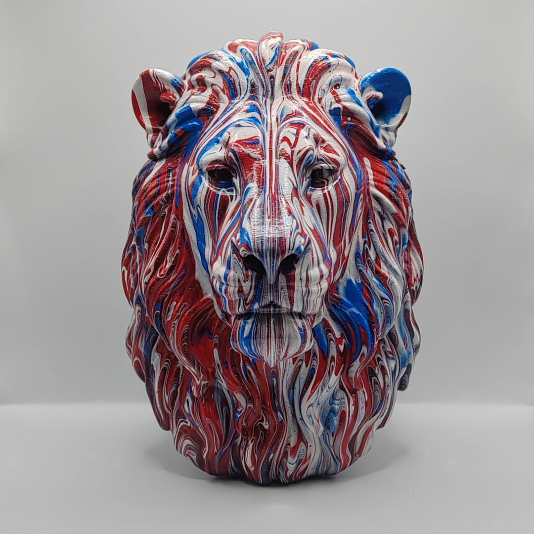 Front view of a hand-painted lion head ornament in red, white and blue