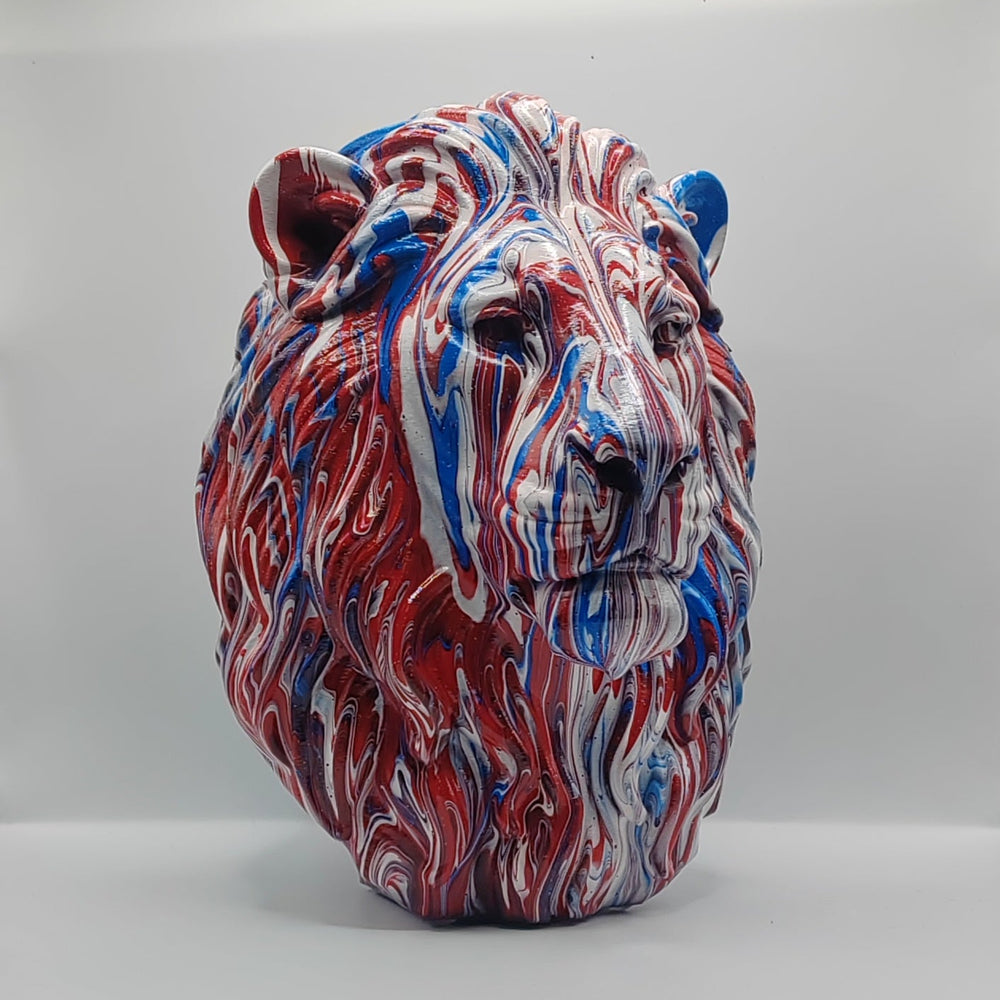 Three-quarter view of a red, white and blue lion head sculpture