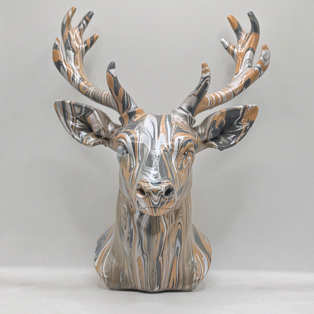 Front view of a hand-painted stag head ornament in bronze, silver and black