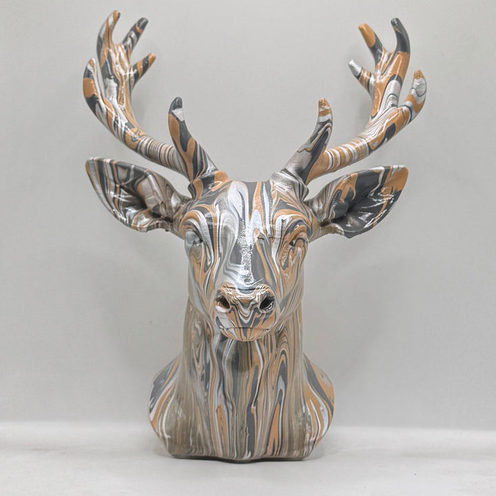 Front view of a hand-painted stag head ornament in bronze, silver and black