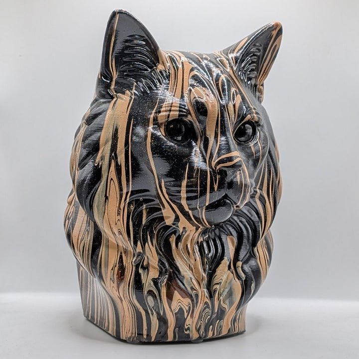 Black and beige Ragdoll cat sculpture, angled view