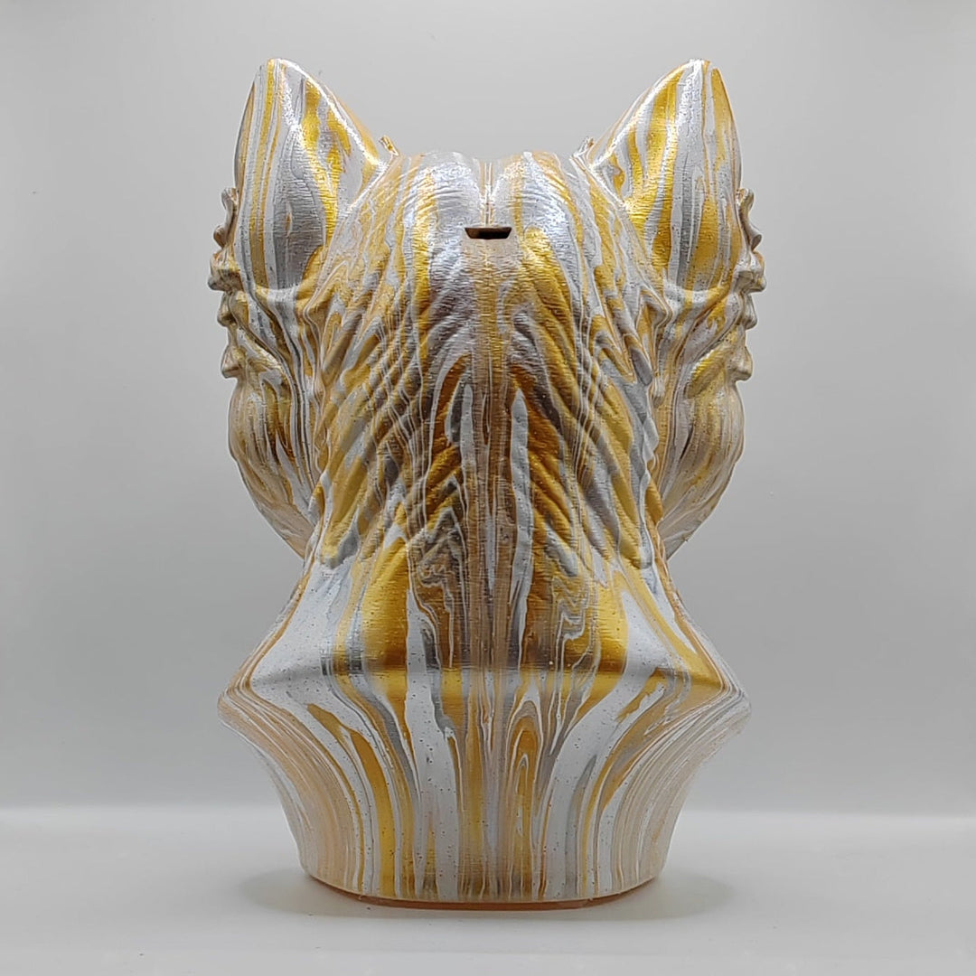 Rear view of a hand-painted gold, white and grey Westie dog ornament